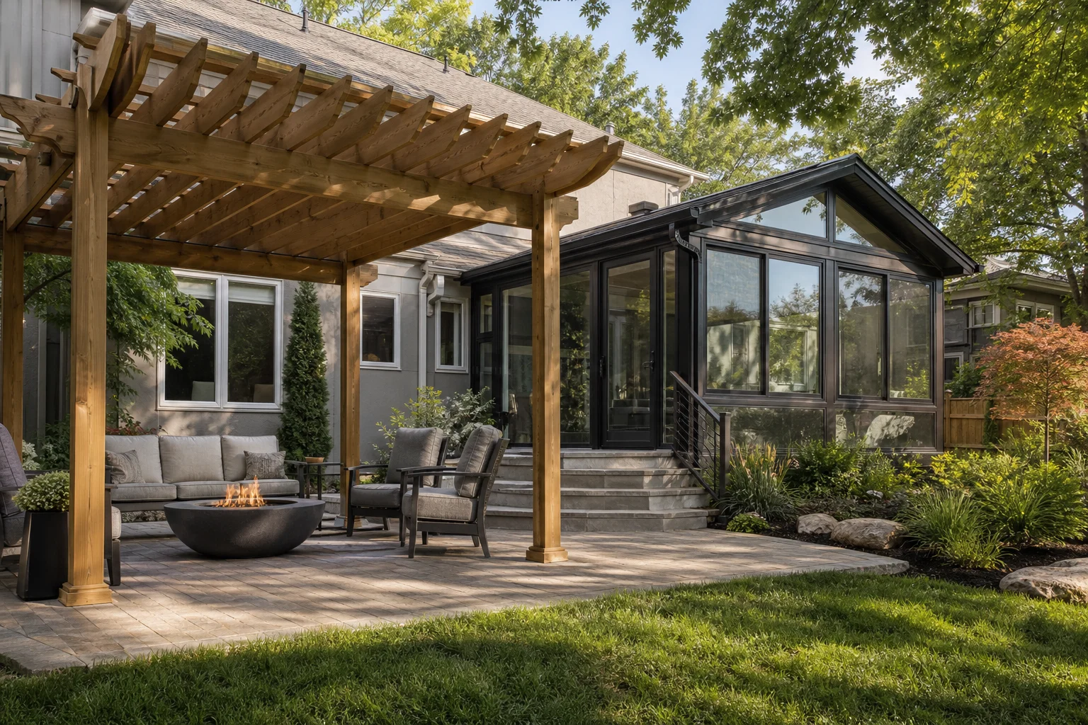 Wooden pergola shading a patio next to a glass sunroom addition on a Kansas City home
